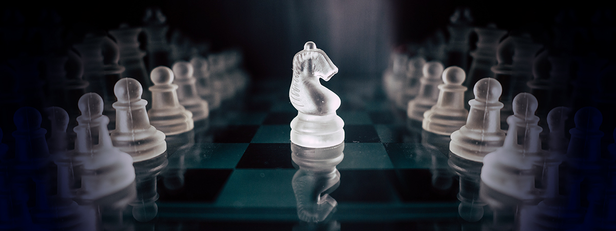 Glass chess piece stands out among white pieces, symbolizing new brand strategy delivering value to customers.